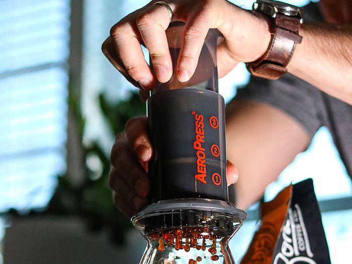 pressing coffee with an aeropress brewer